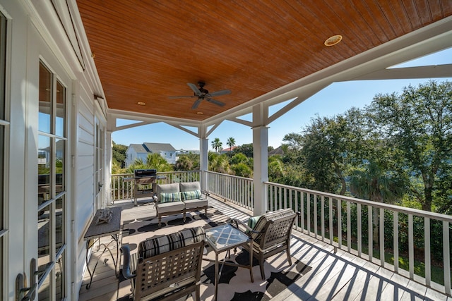 deck featuring an outdoor living space and ceiling fan