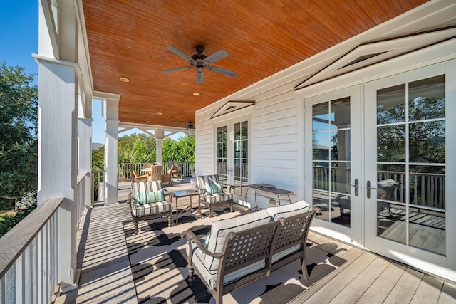 wooden deck featuring an outdoor hangout area, ceiling fan, and french doors