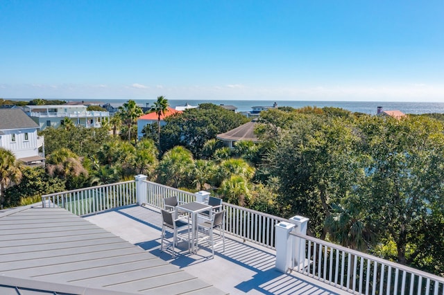 wooden deck featuring a water view