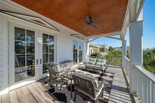 deck with ceiling fan, french doors, and an outdoor hangout area