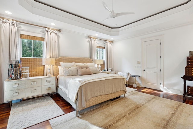 bedroom with dark wood-type flooring and multiple windows