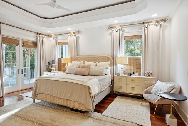 bedroom with ornamental molding, ceiling fan, and dark hardwood / wood-style flooring