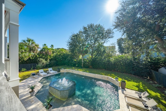 view of pool featuring a yard and a patio area