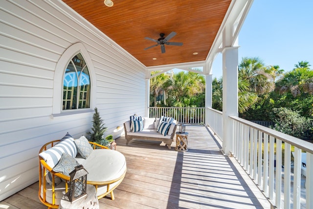 deck featuring ceiling fan and outdoor lounge area