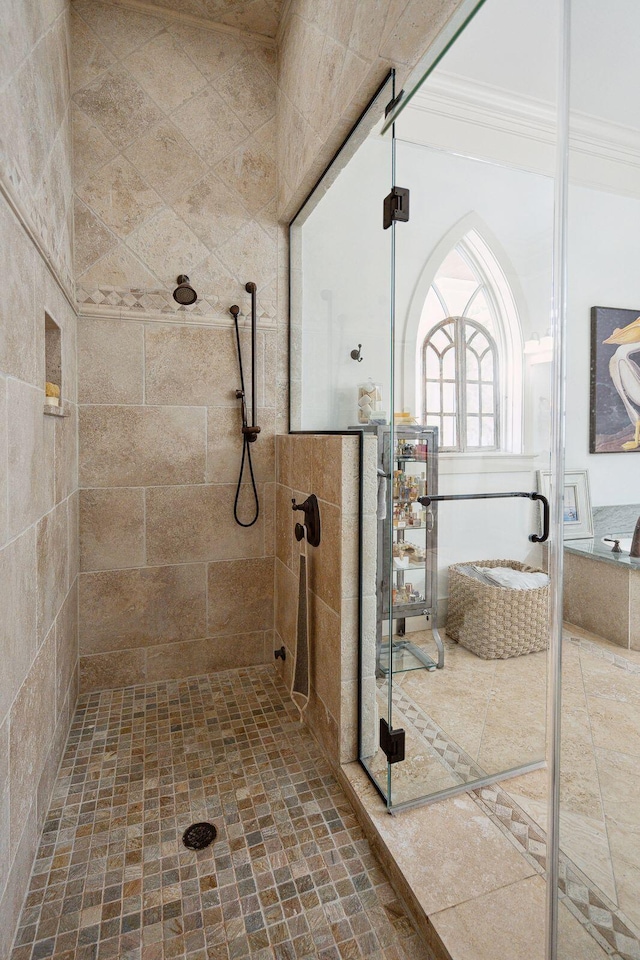 bathroom featuring walk in shower and ornamental molding