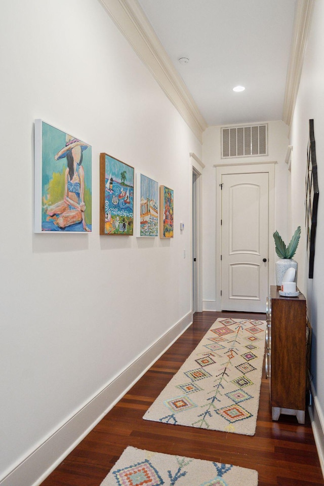 hall featuring crown molding and dark hardwood / wood-style flooring