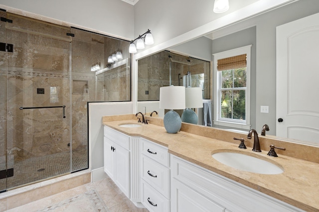 bathroom with ornamental molding, tile patterned flooring, vanity, and a shower with shower door