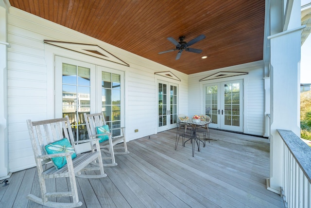 deck featuring french doors and ceiling fan