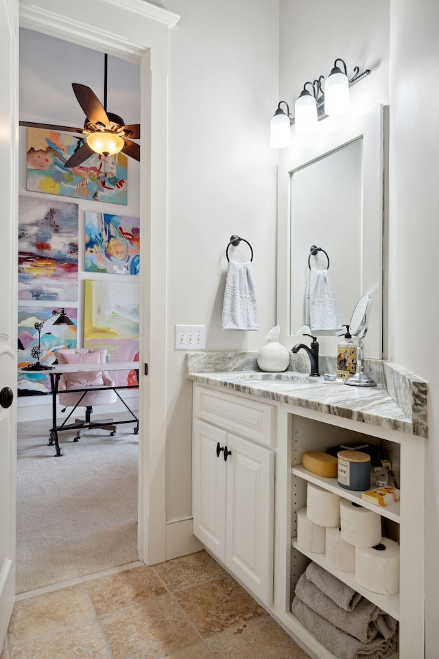 bathroom featuring ceiling fan and vanity