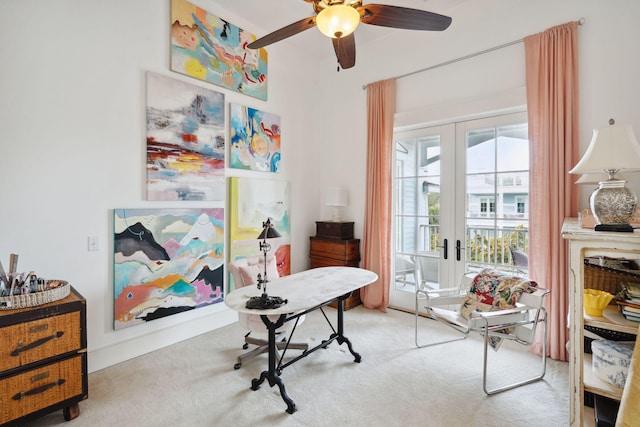 office space with french doors, light colored carpet, and ceiling fan