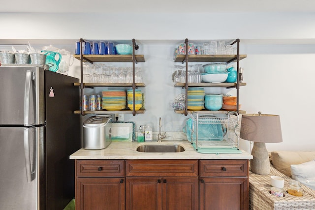 interior space with stainless steel refrigerator and sink