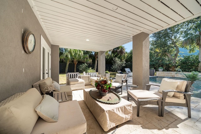 view of patio with outdoor lounge area and pool water feature