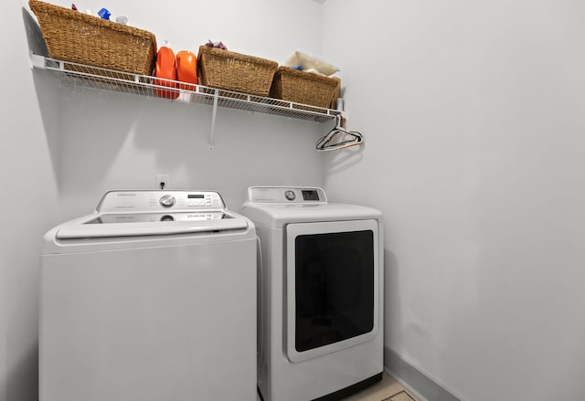 404 Omaha Dr, Moncks Corner, SC 29461 - laundry area with washing machine and clothes dryer and baseboards