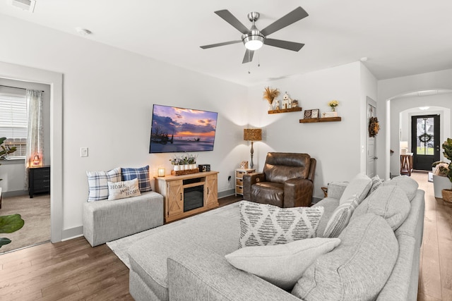 404 Omaha Dr, Moncks Corner, SC 29461 - living room with arched walkways, wood finished floors, a ceiling fan, and baseboards