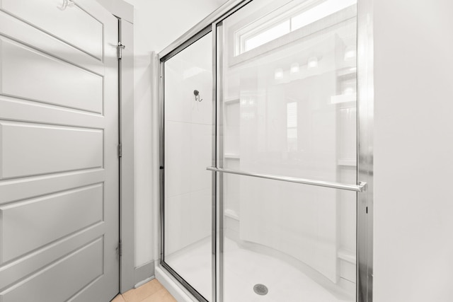 404 Omaha Dr, Moncks Corner, SC 29461 - bathroom featuring a stall shower and tile patterned flooring