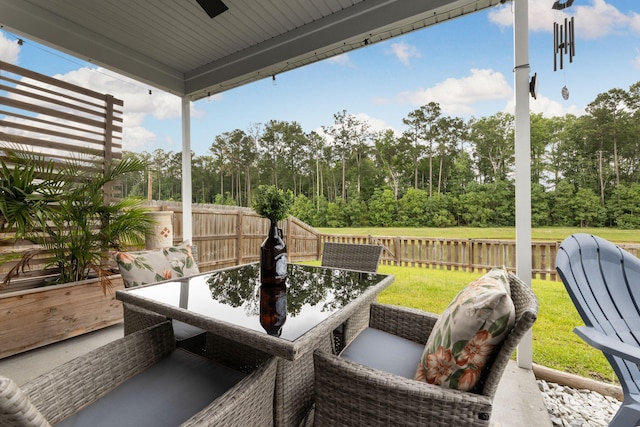 404 Omaha Dr, Moncks Corner, SC 29461 - view of patio / terrace with ceiling fan, outdoor dining area, and view of wooded area