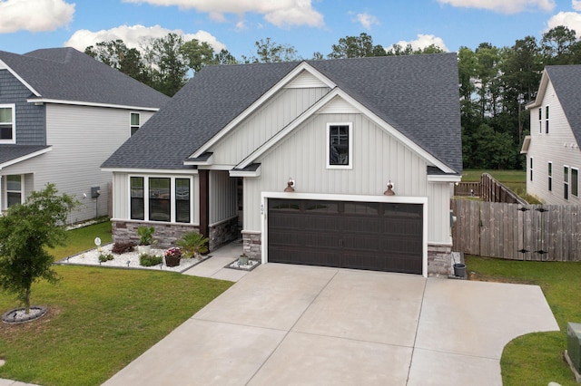 404 Omaha Dr, Moncks Corner, SC 29461 - view of front of home with a shingled roof, board and batten siding, and stone siding