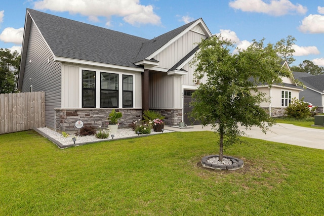 404 Omaha Dr, Moncks Corner, SC 29461 - craftsman-style house with a shingled roof, stone siding, board and batten siding, driveway, and an attached garage
