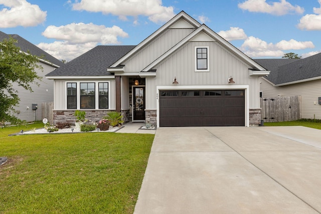 404 Omaha Dr, Moncks Corner, SC 29461 - view of front of home featuring board and batten siding, driveway, and stone siding