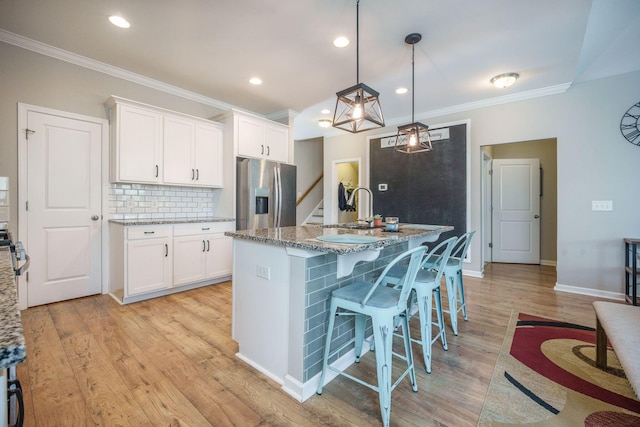 419 Whispering Breeze Ln, Summerville, SC 29486 - kitchen featuring a sink, ornamental molding, stainless steel refrigerator with ice dispenser, and white cabinets