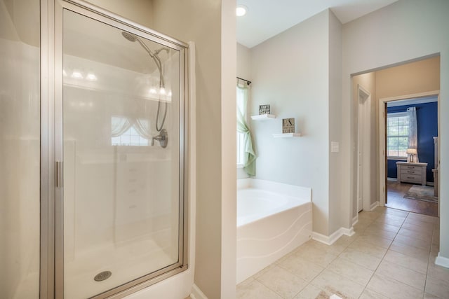 419 Whispering Breeze Ln, Summerville, SC 29486 - bathroom with baseboards, tile patterned flooring, a shower stall, and a bath