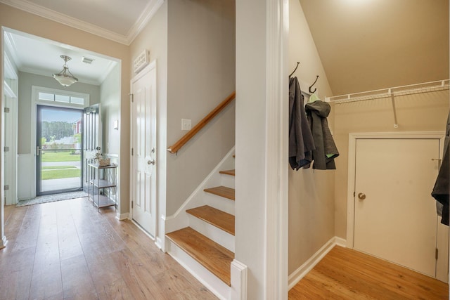 419 Whispering Breeze Ln, Summerville, SC 29486 - foyer entrance with visible vents, stairway, baseboards, ornamental molding, and light wood-style flooring