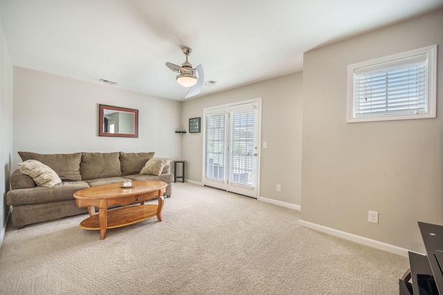 419 Whispering Breeze Ln, Summerville, SC 29486 - carpeted living area featuring a ceiling fan, baseboards, visible vents, and plenty of natural light