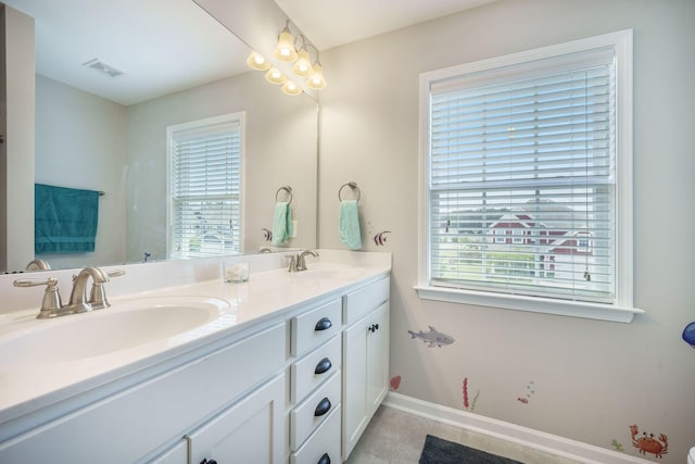 419 Whispering Breeze Ln, Summerville, SC 29486 - bathroom featuring a sink, baseboards, double vanity, and visible vents