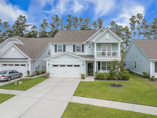 419 Whispering Breeze Ln, Summerville, SC 29486 - view of front of home with a front lawn, a balcony, a shingled roof, an attached garage, and driveway