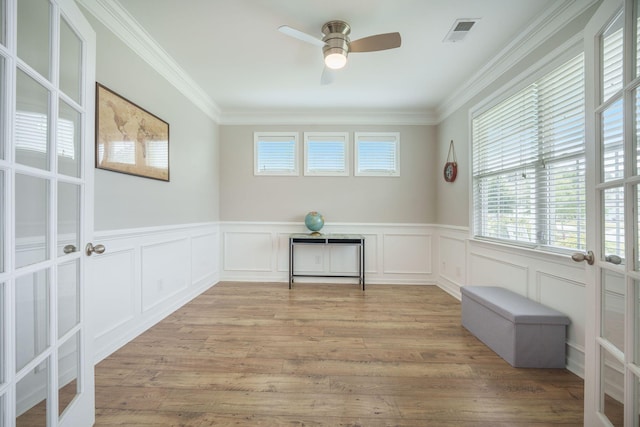 419 Whispering Breeze Ln, Summerville, SC 29486 - empty room featuring visible vents, ornamental molding, wainscoting, french doors, and a ceiling fan
