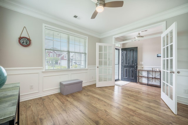 419 Whispering Breeze Ln, Summerville, SC 29486 - interior space featuring french doors, visible vents, wainscoting, wood finished floors, and ornamental molding