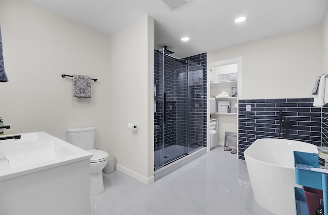 full bath featuring visible vents, a freestanding tub, recessed lighting, a stall shower, and toilet