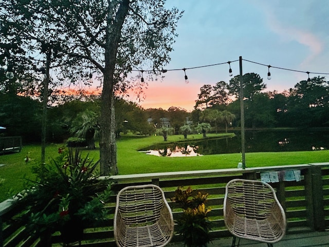 view of home's community with a water view