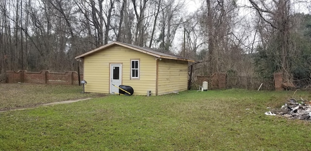 view of outbuilding featuring an outbuilding and fence