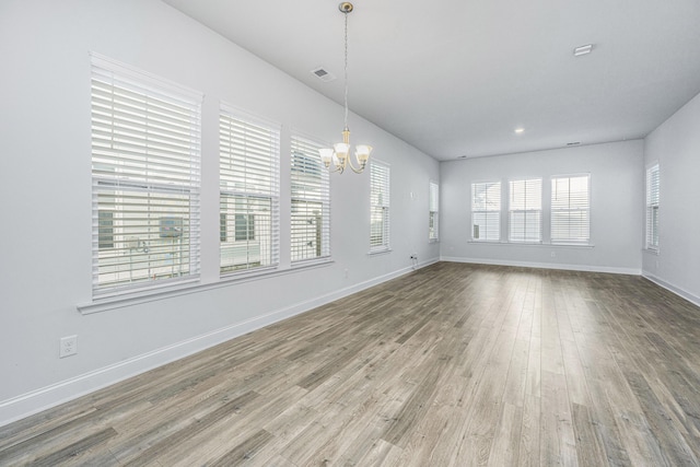 interior space featuring a notable chandelier and hardwood / wood-style floors