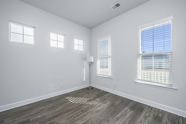 empty room featuring dark wood-type flooring