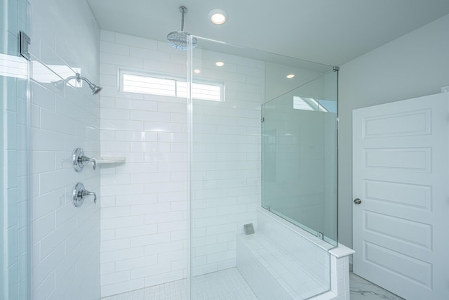 bathroom featuring an enclosed shower