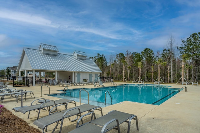 view of swimming pool featuring a patio