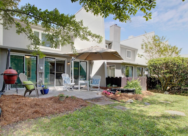 1307 Ventura Pl, Mount Pleasant, SC 29464 - rear view of house with a patio, a yard, and stucco siding