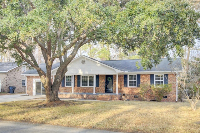 ranch-style house with a front lawn