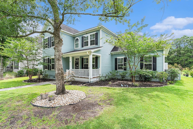 view of front of property featuring a front lawn and a porch