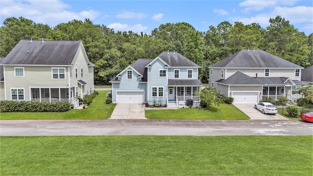 view of front of house with a garage and a front yard