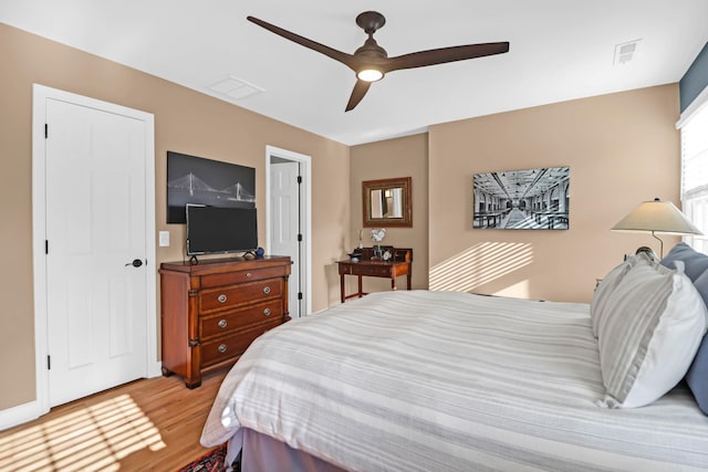 bedroom featuring ceiling fan and light hardwood / wood-style flooring