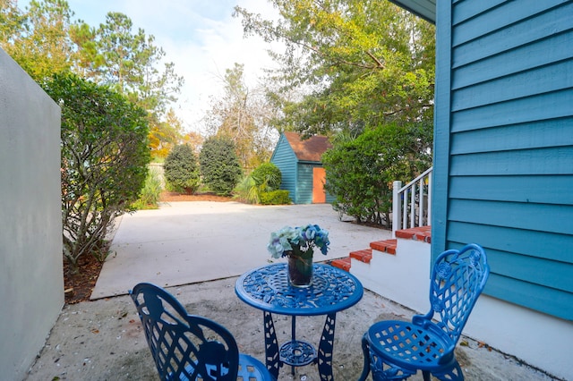 view of patio with a shed