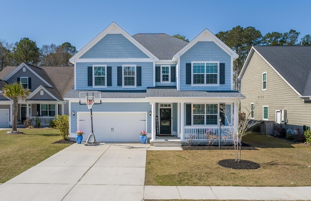 view of front of property with an attached garage, covered porch, concrete driveway, and a front yard