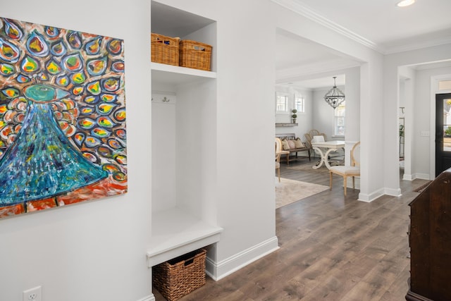 mudroom with baseboards, dark wood finished floors, recessed lighting, crown molding, and a notable chandelier