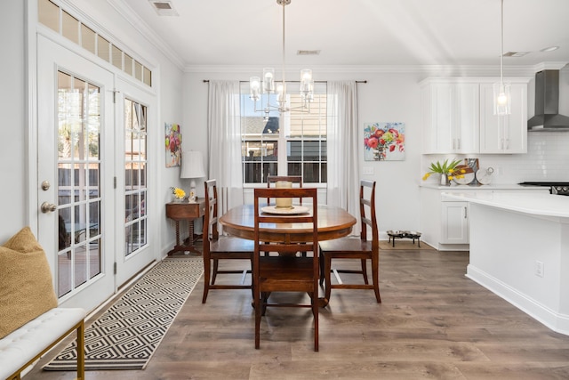 dining area with a wealth of natural light, dark wood-style floors, and ornamental molding