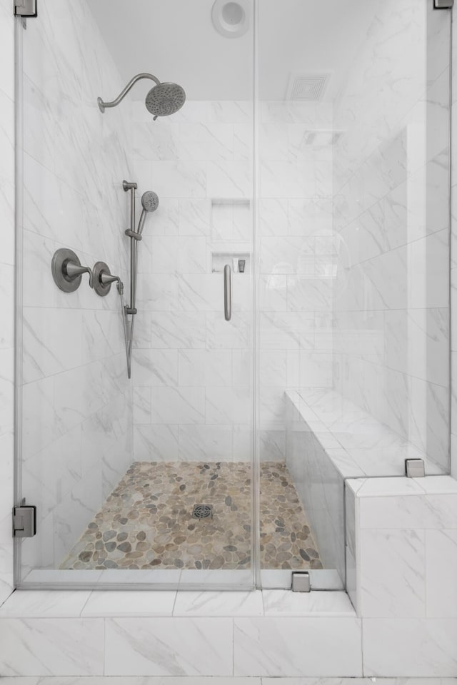 bathroom with a stall shower