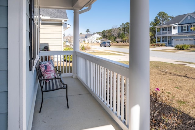 balcony with a residential view and covered porch