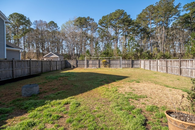 view of yard with a fenced backyard